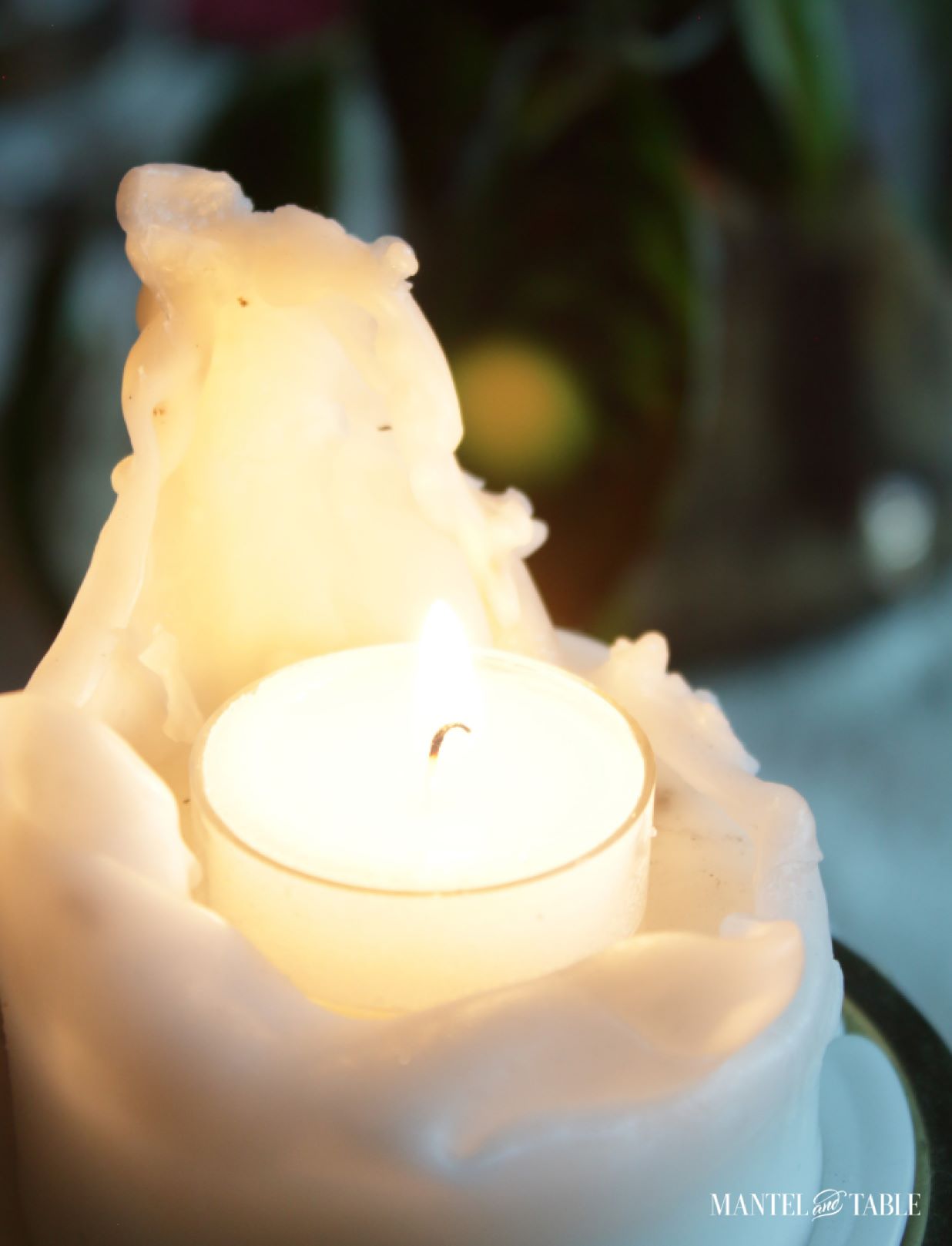Super close up of tea candle inside pillar candle