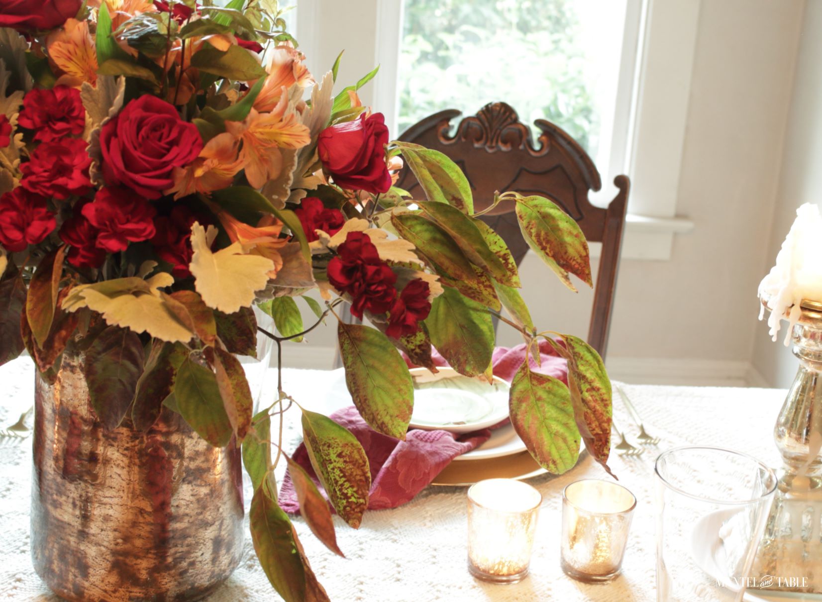 Closeup of flower centerpiece with draping dogwood branch
