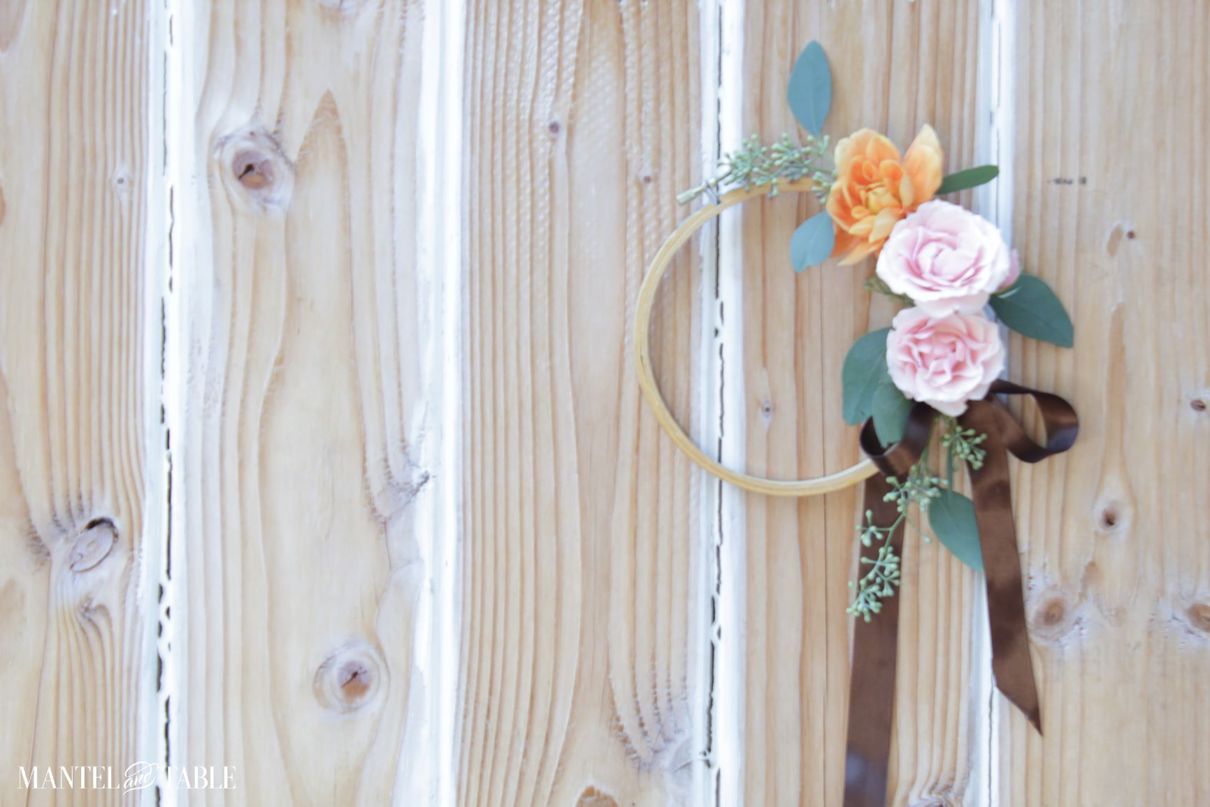 Embroidery hoop wreath with orange and pink flowers