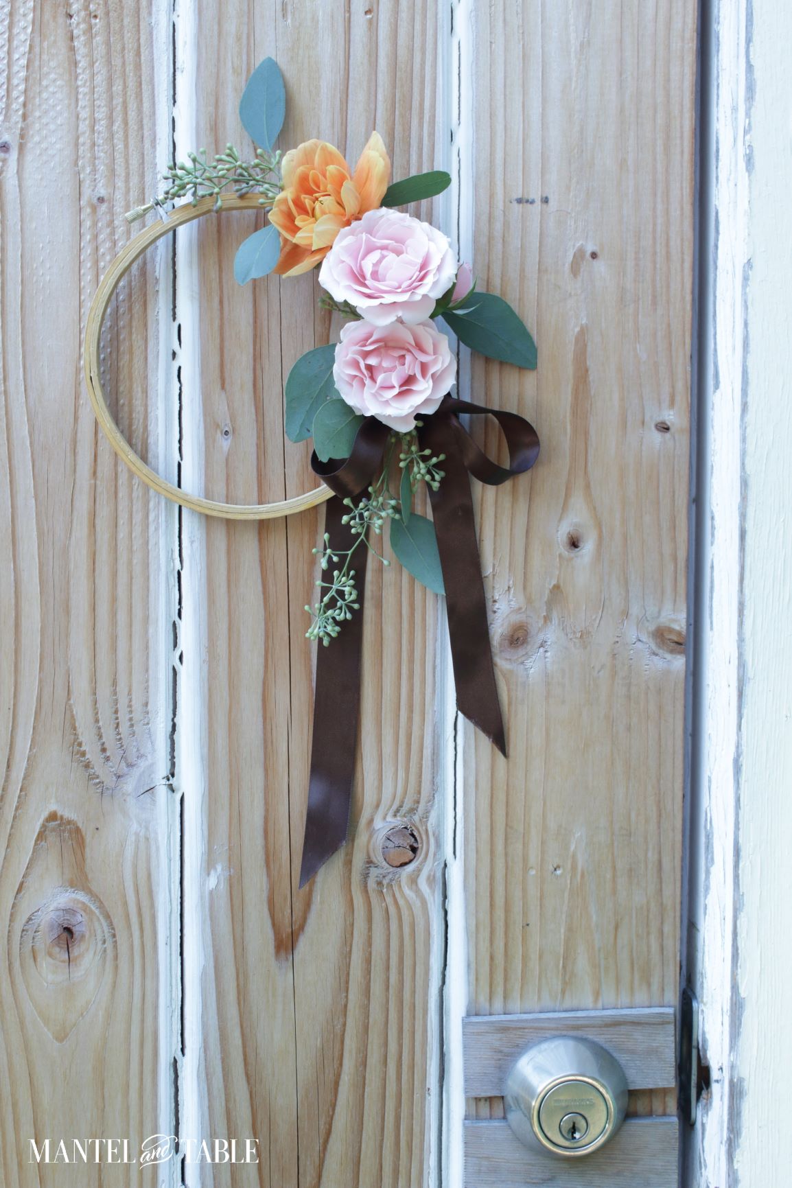 Pink and orange Fall wreath on door