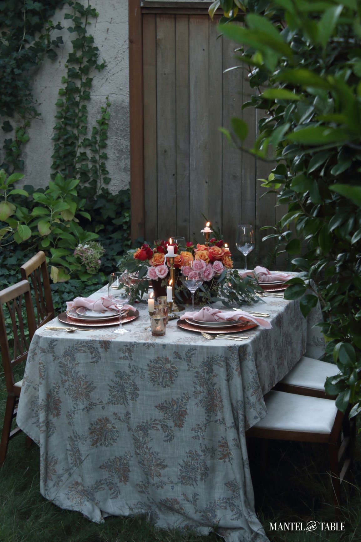 Pink and orange tablescape outside in the yard