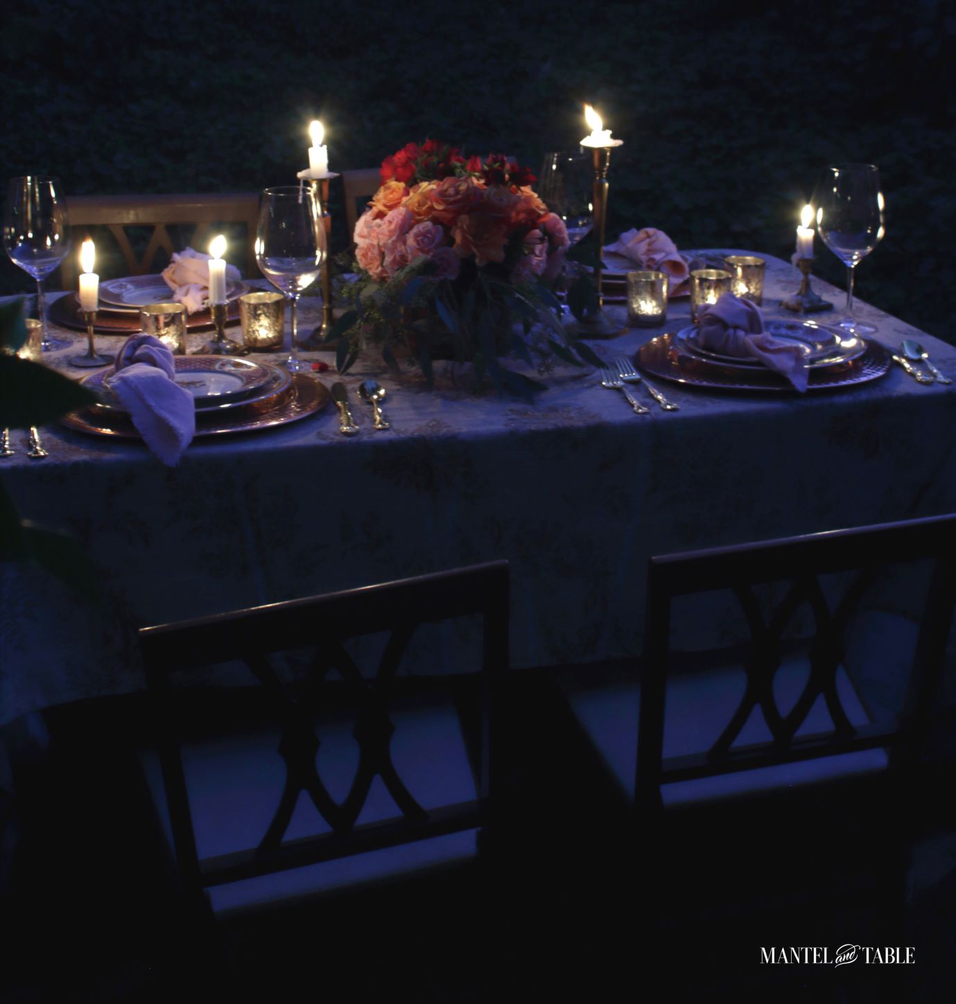 Full table setting in the dark with candle light