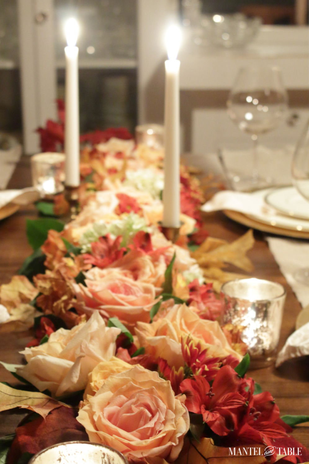 Peach pink and red flower garland on fall tablescape
