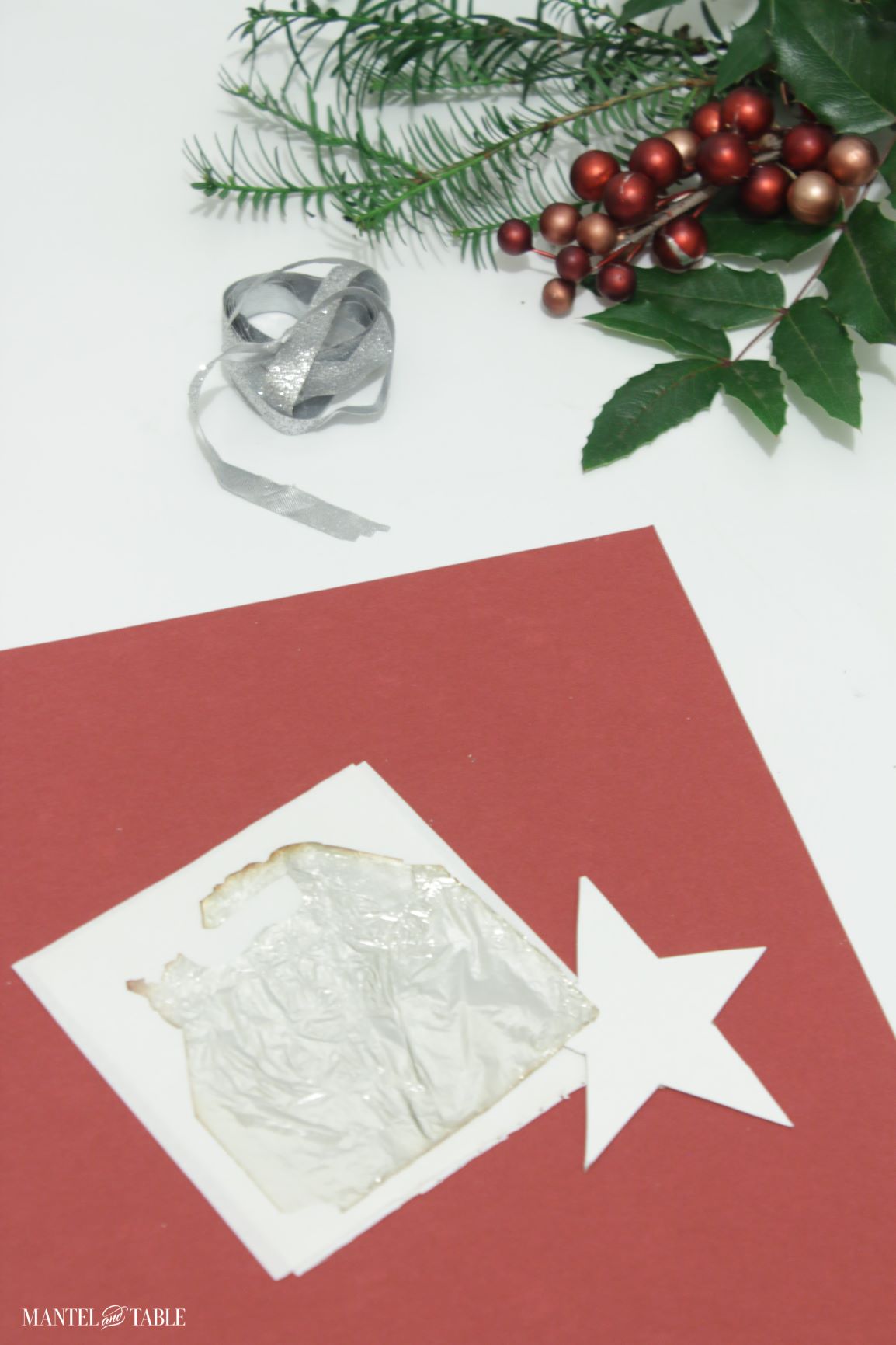 DIY Christmas Ornament - star cutout and sheet of silver leaf
