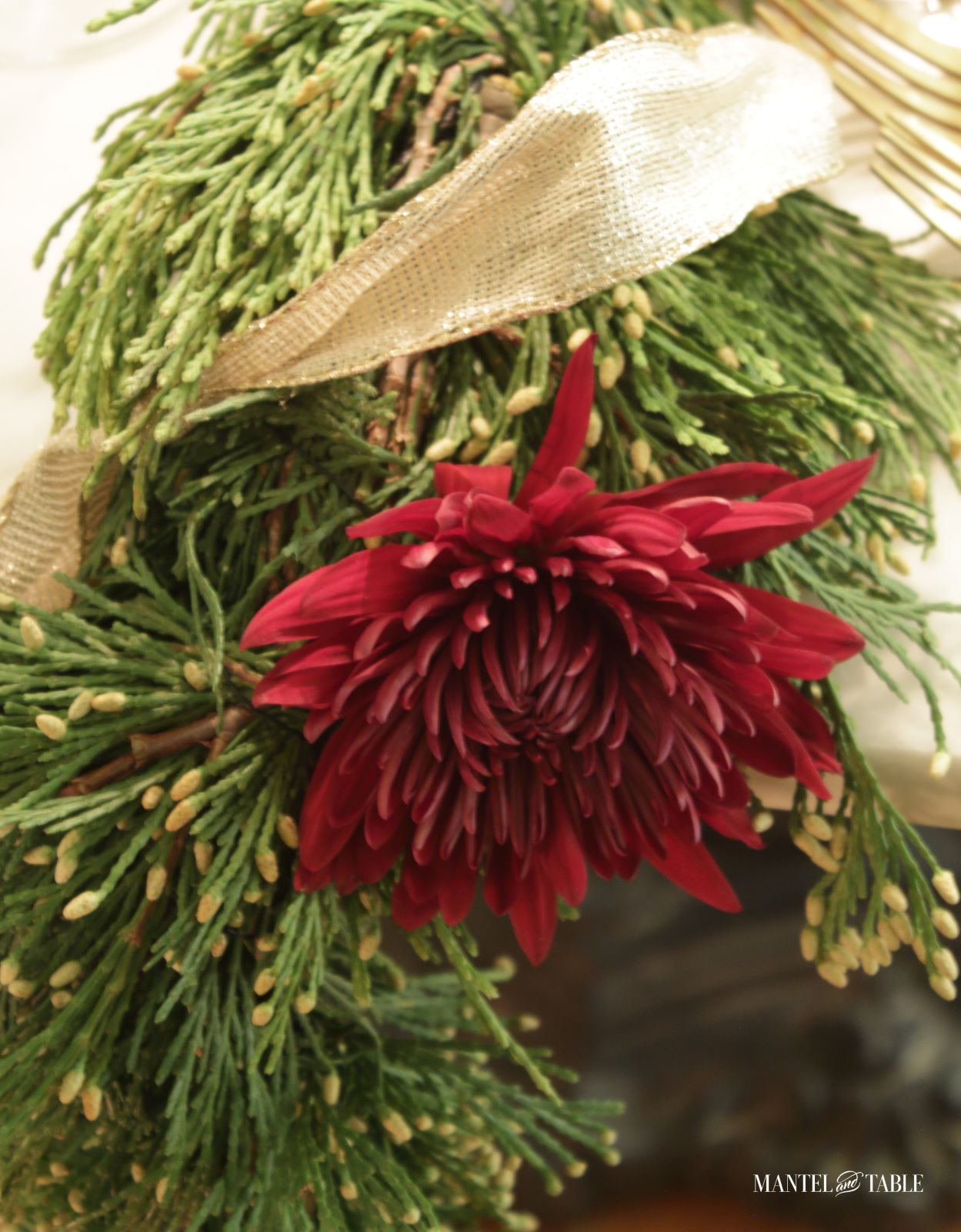 Closeup of red mum in garland centerpiece
