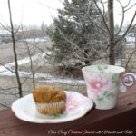 Teacup Adventure - teacup on balcony railing, muffin on saucer