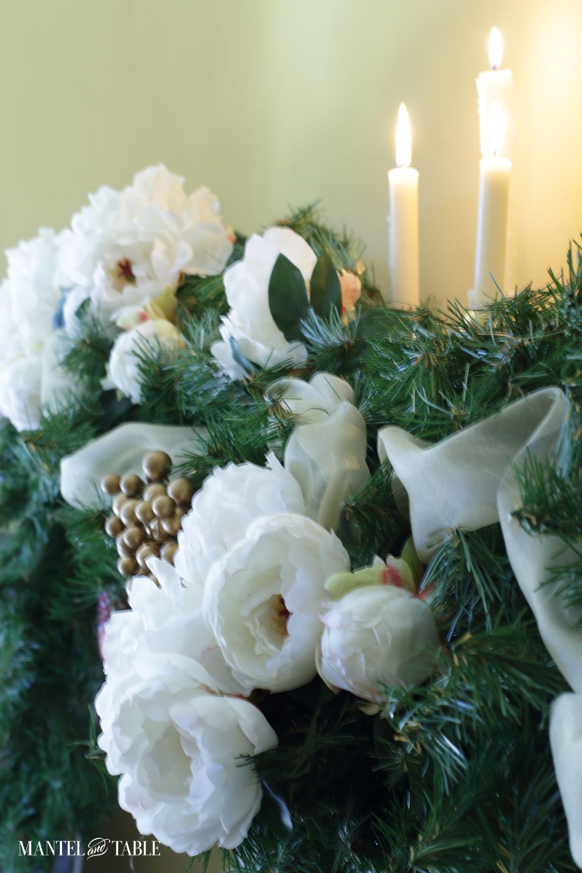 White peony mantel closeup of peonies and evergreens