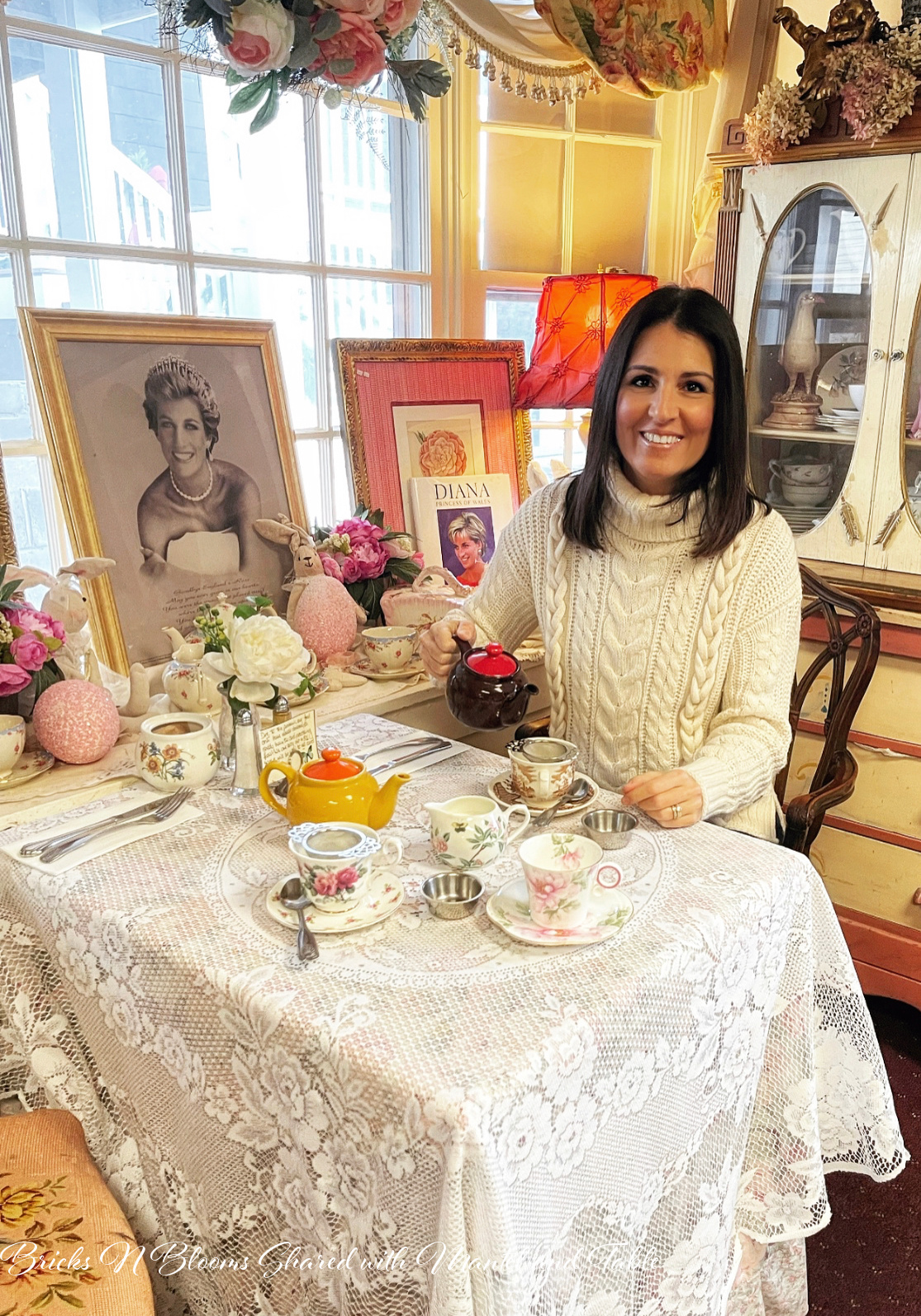 Lovely woman pouring high tea at a Victorian-style tea shop