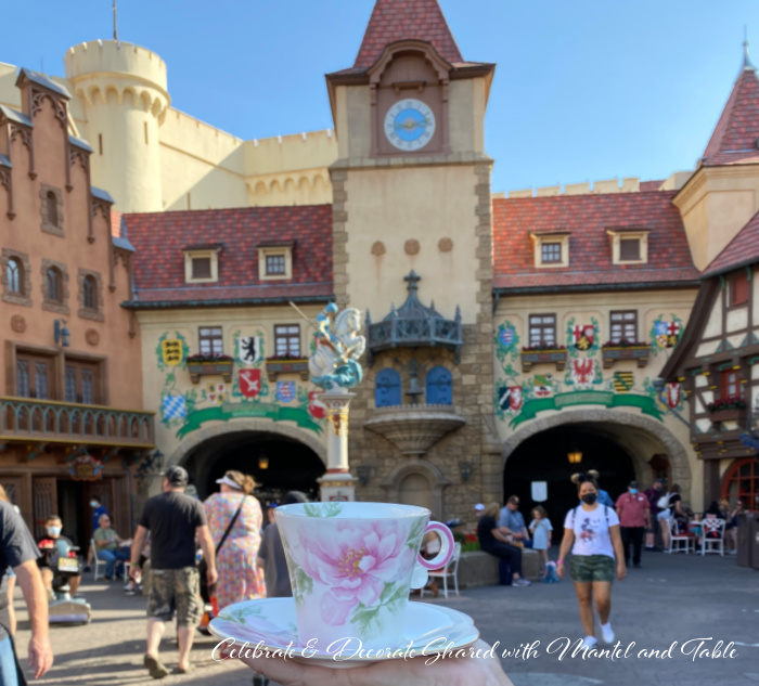 Tea at EPCOT - pink and white teacup and saucer in front of the Germany Pavilion