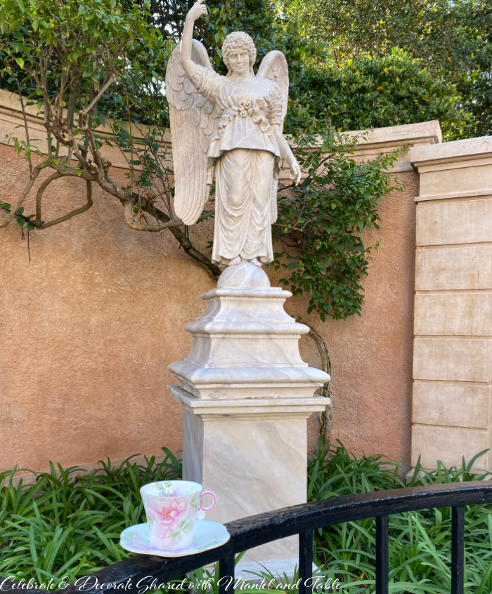 Tea at Epcot - Teacup in front of angel statue