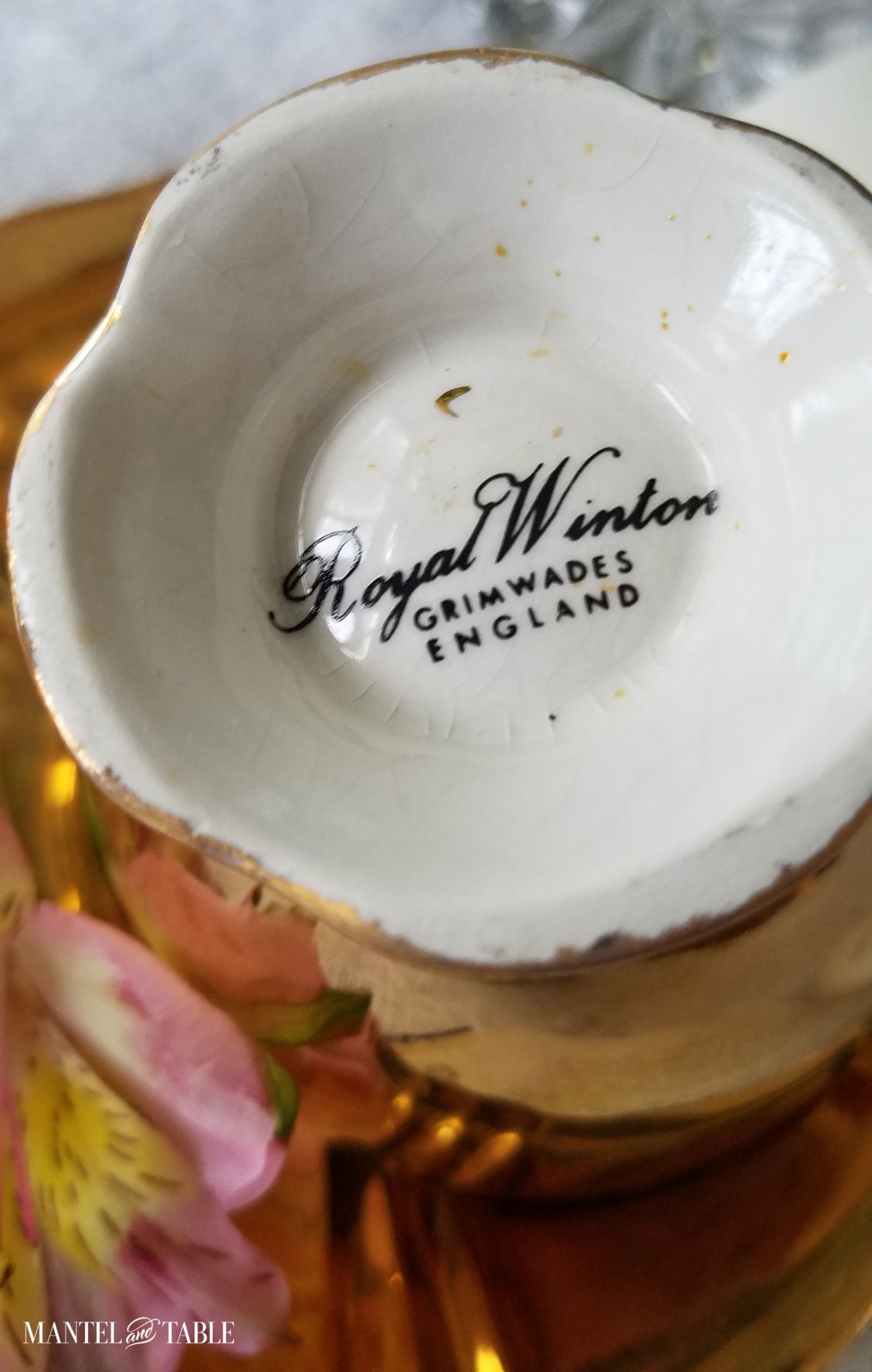 Underside of gold teacup