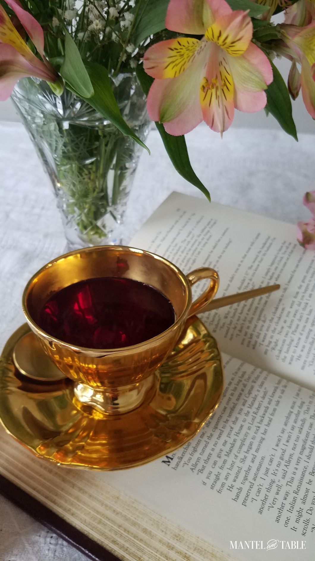Gold teacup with red tea from above