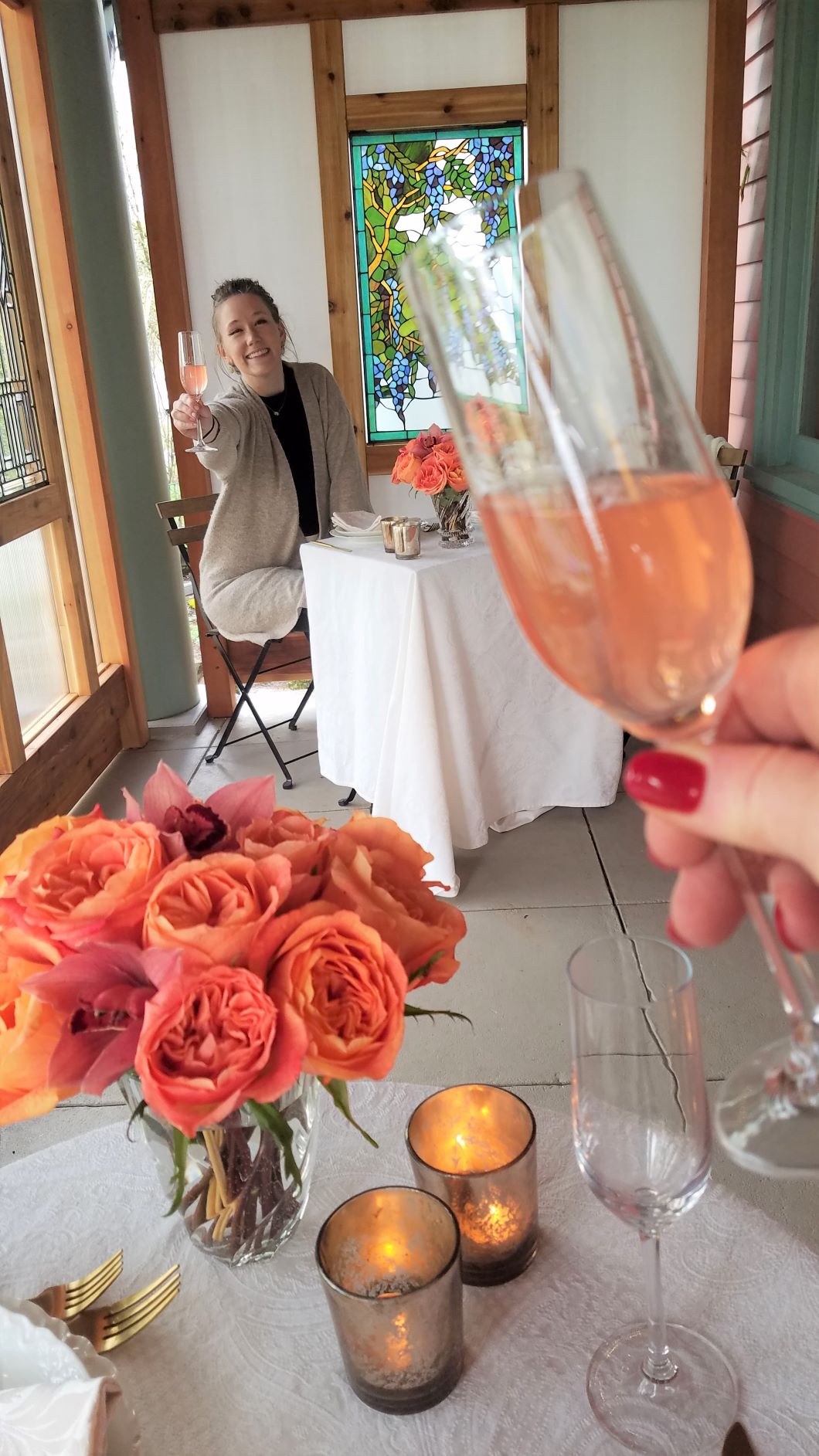 Socially distant "champagne" toast from separate tables