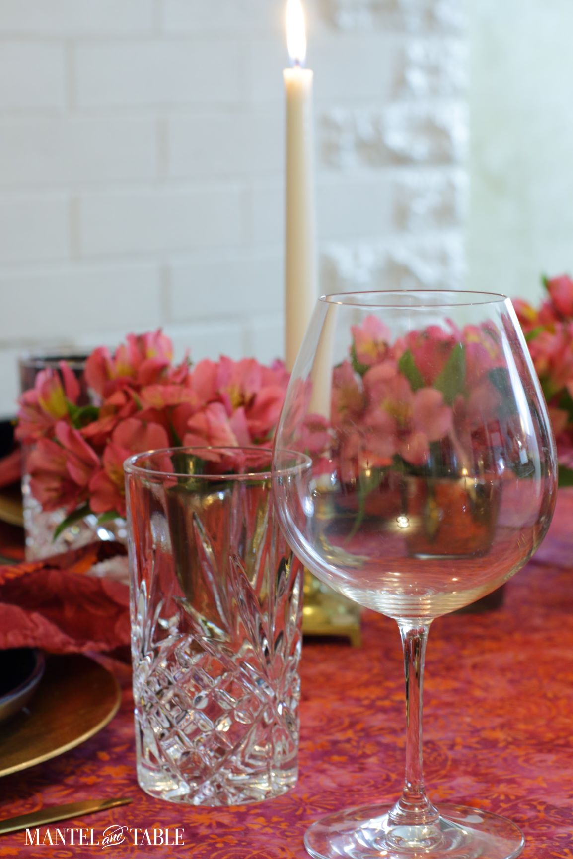 Closeup of water and wine glasses in red & blue place setting