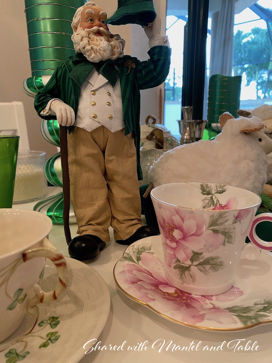 St Patrick's Day tablescape with white bearded gnome, green candles and teacups
