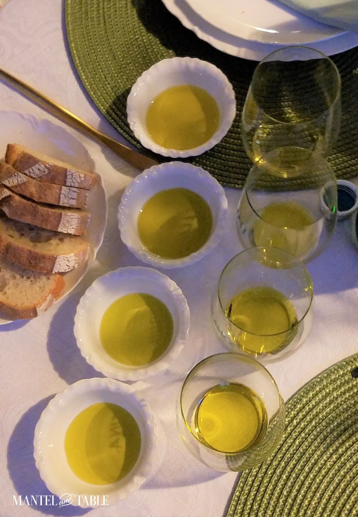 Small bowls and glasses of olive oil from above