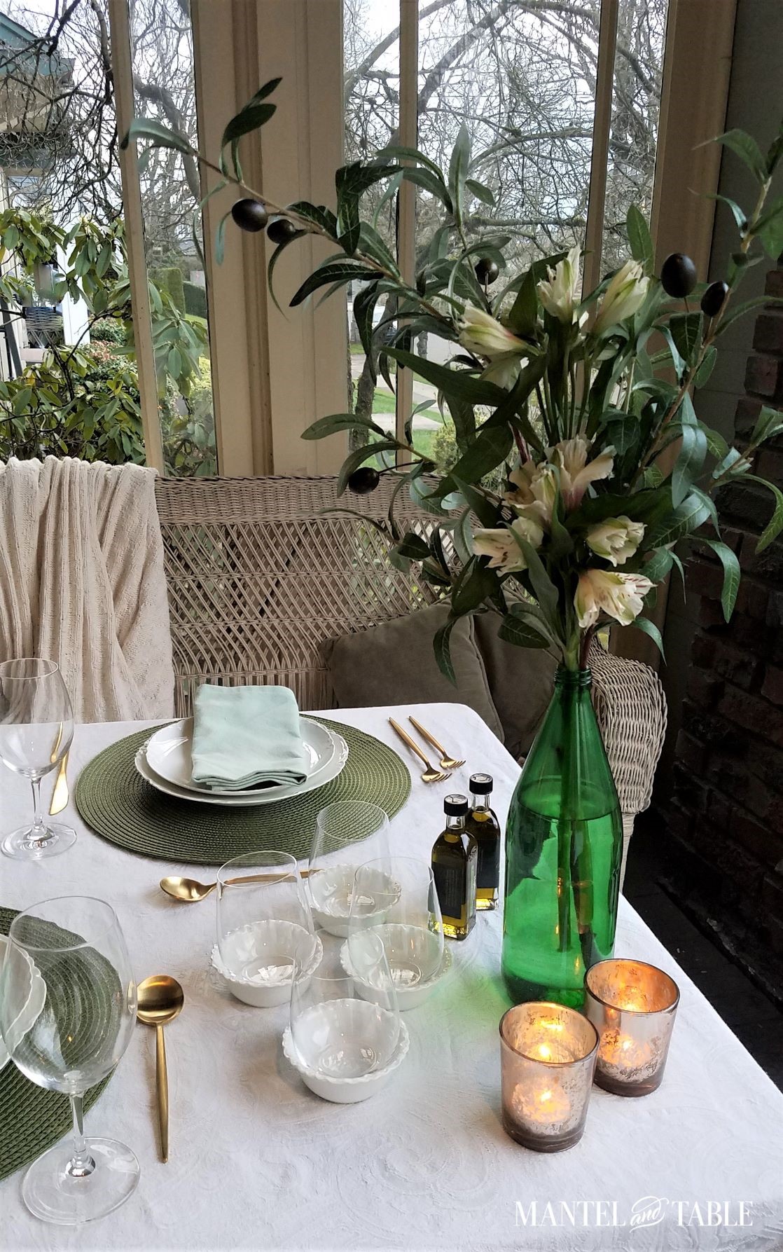 Green and white tablescape set for olive oil tasting