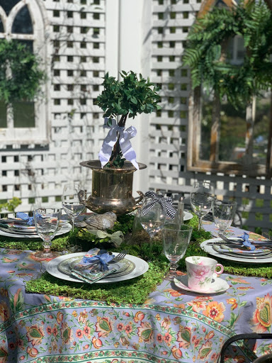 Teacup on outdoor table done in green and french blue, set for tea party,