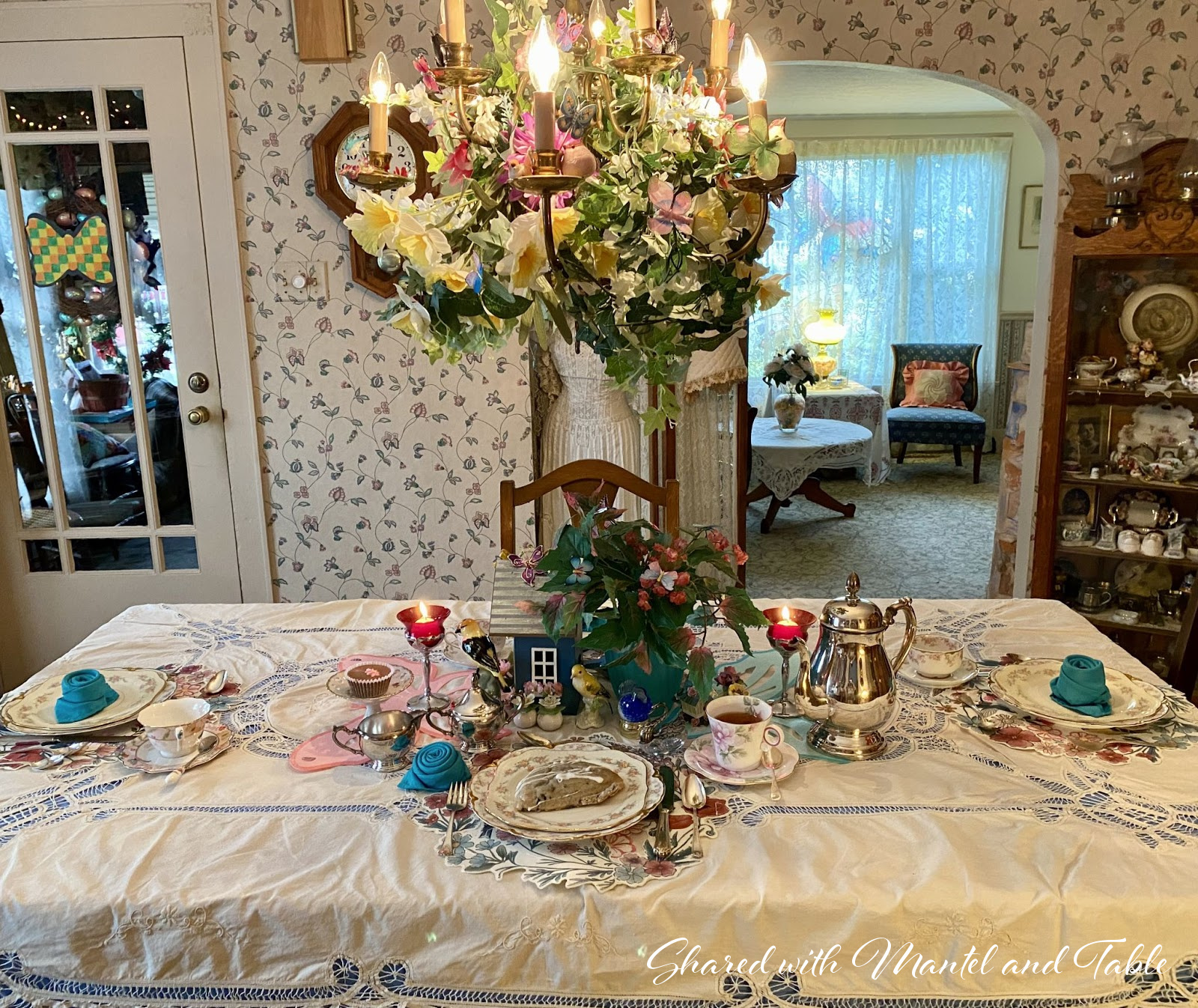 Full view of breakfast table and decorated chandelier