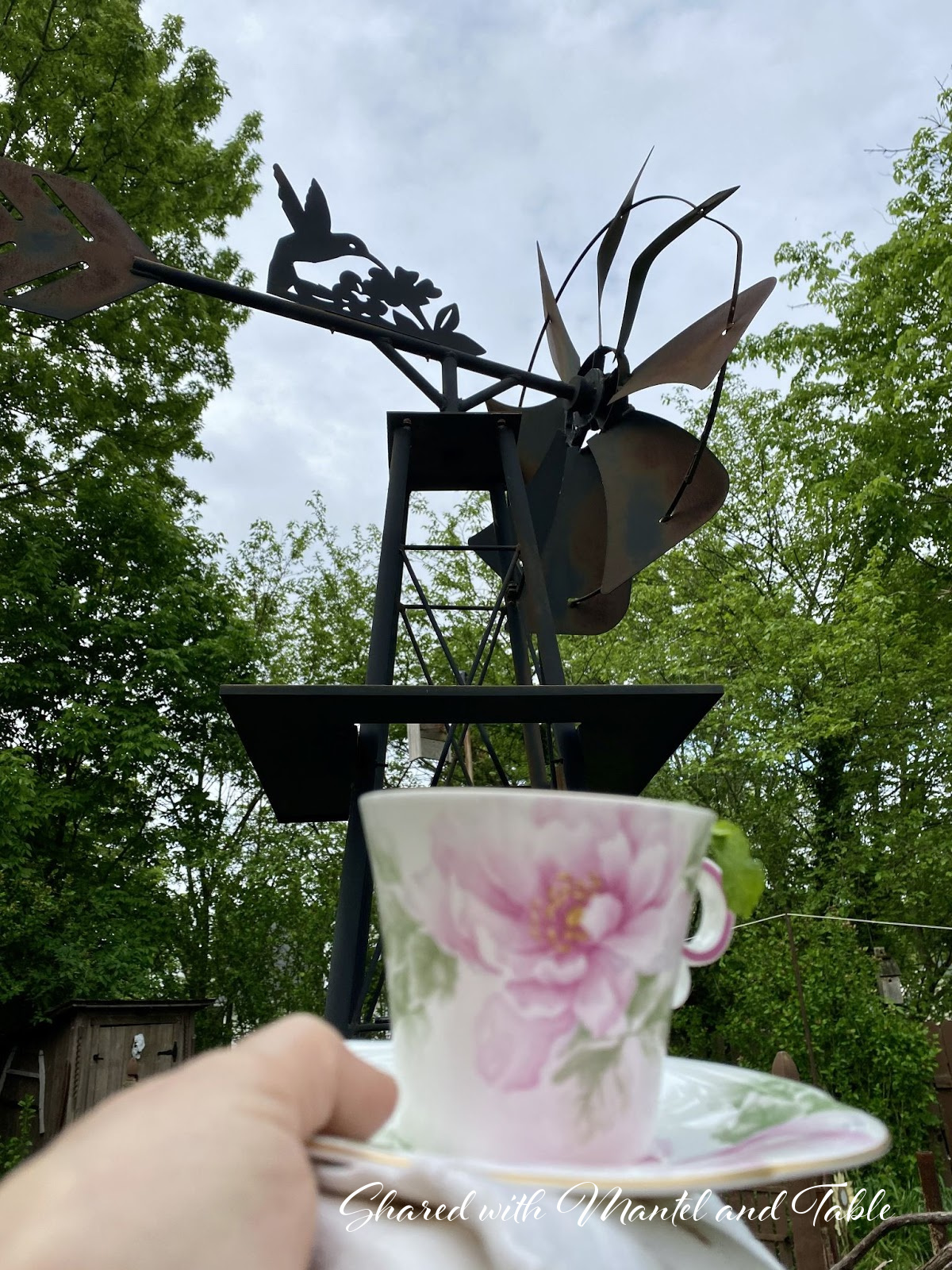 Traveling Teacup with large metal sculpture wind vane with hummingbird