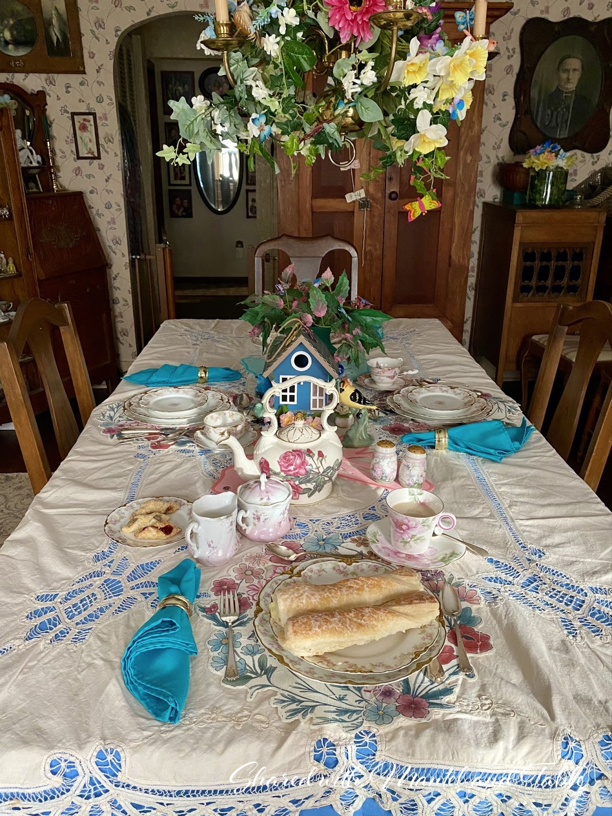 Tea table set with china and spring centerpiece