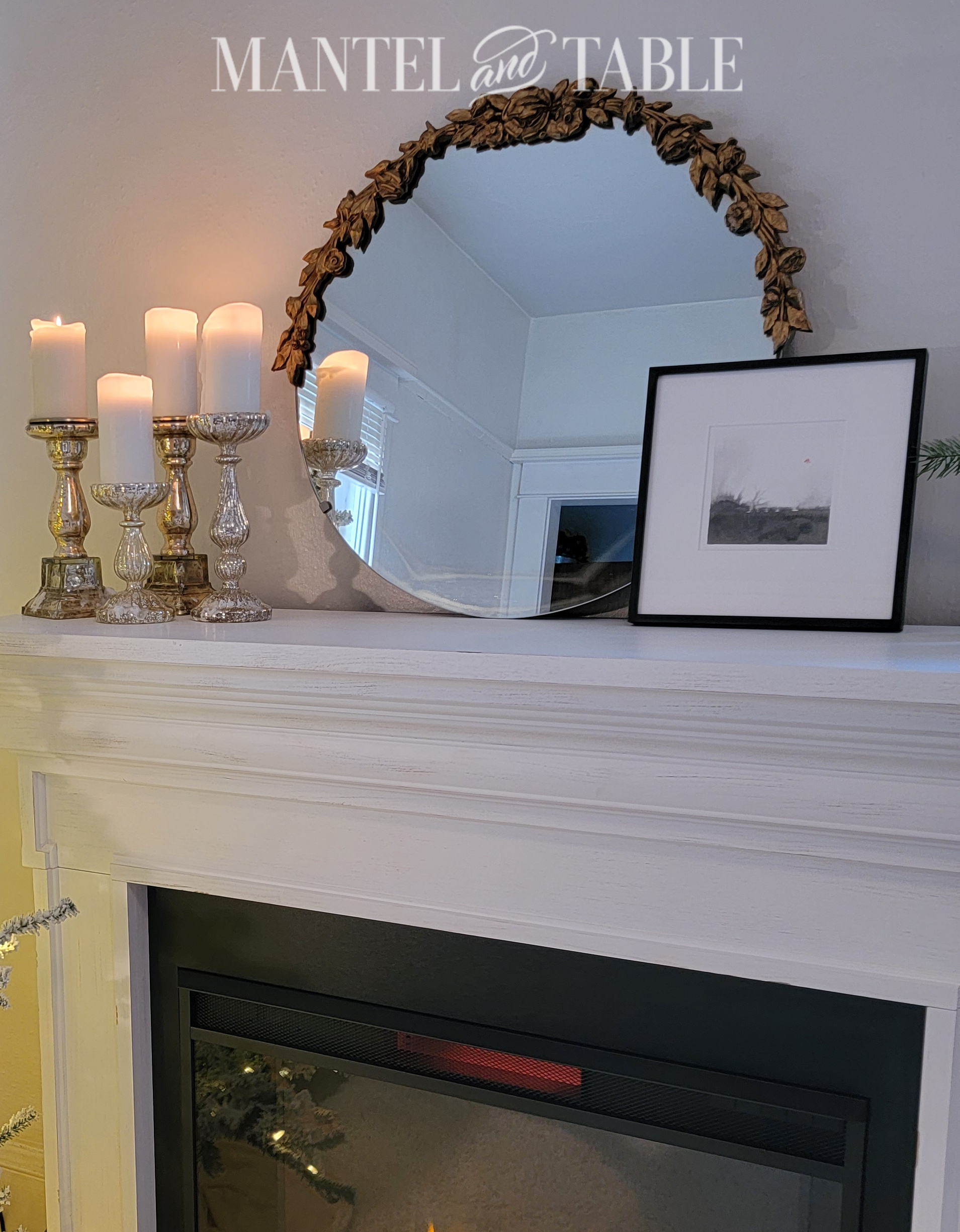 art and round mirror on mantel