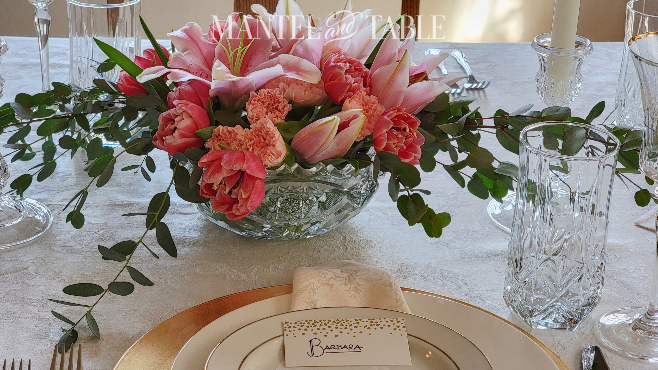 romantic table setting with pink centerpiece closeup