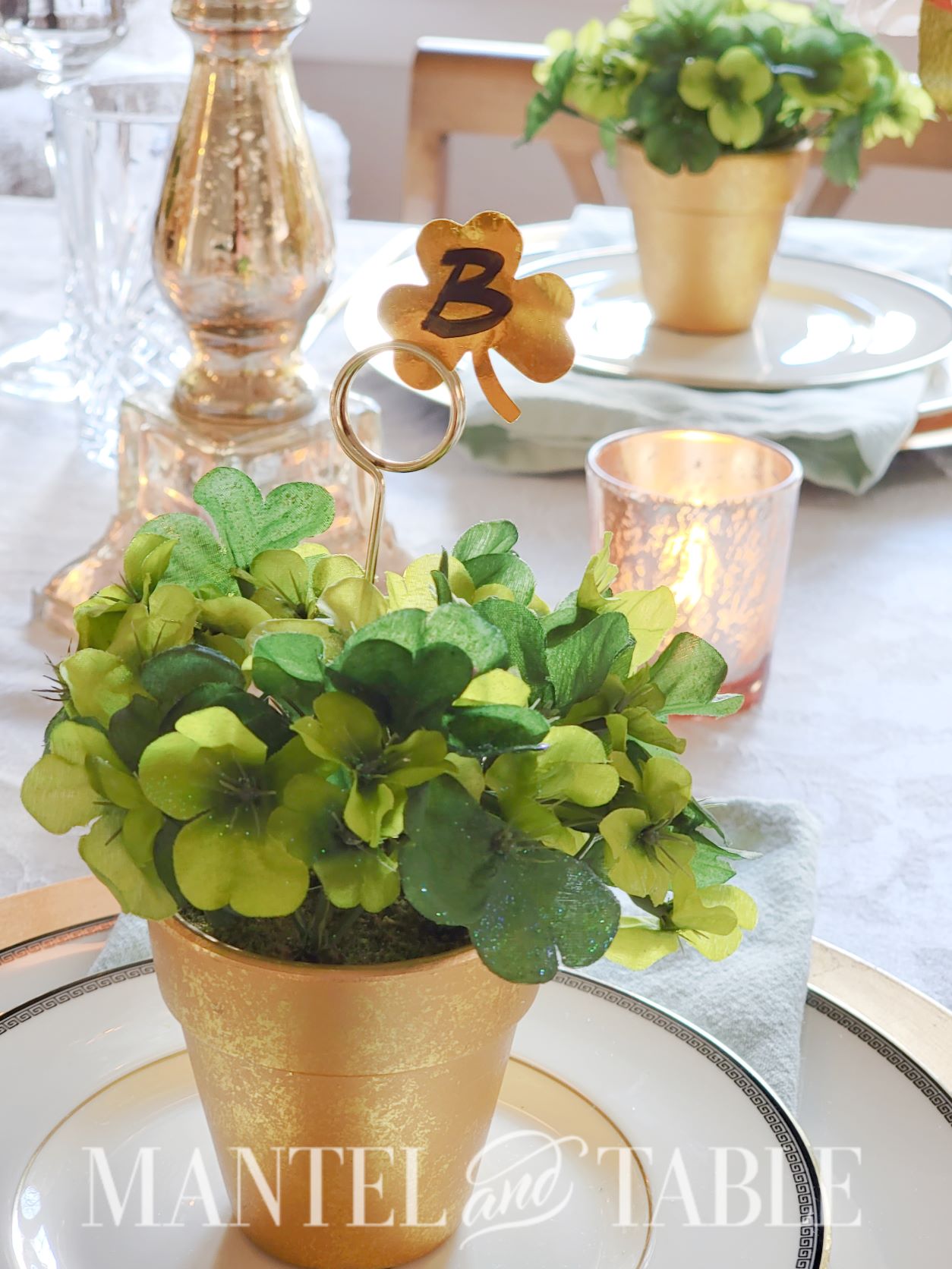 Faux shamrock in gold pot in the center of the St Patrick's Day tablescape
