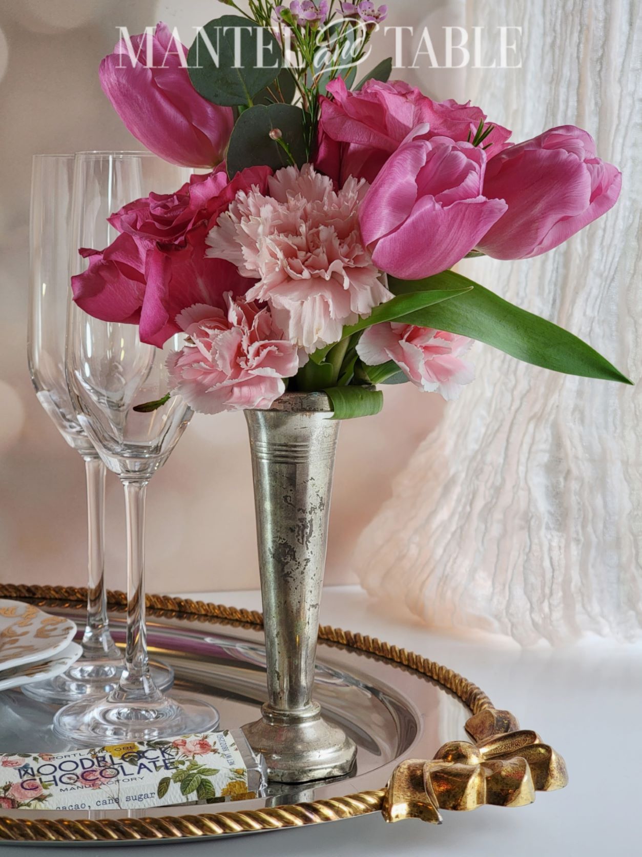Close up of pink flowers in silver vase