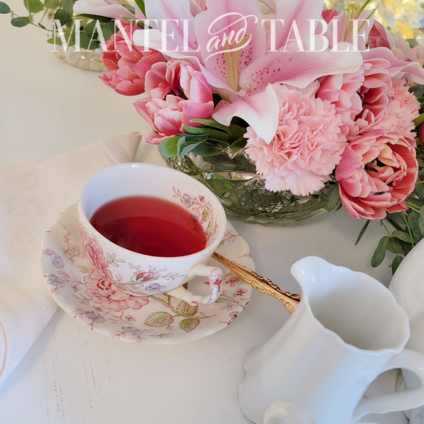 Teacup and flowers at an angle from above