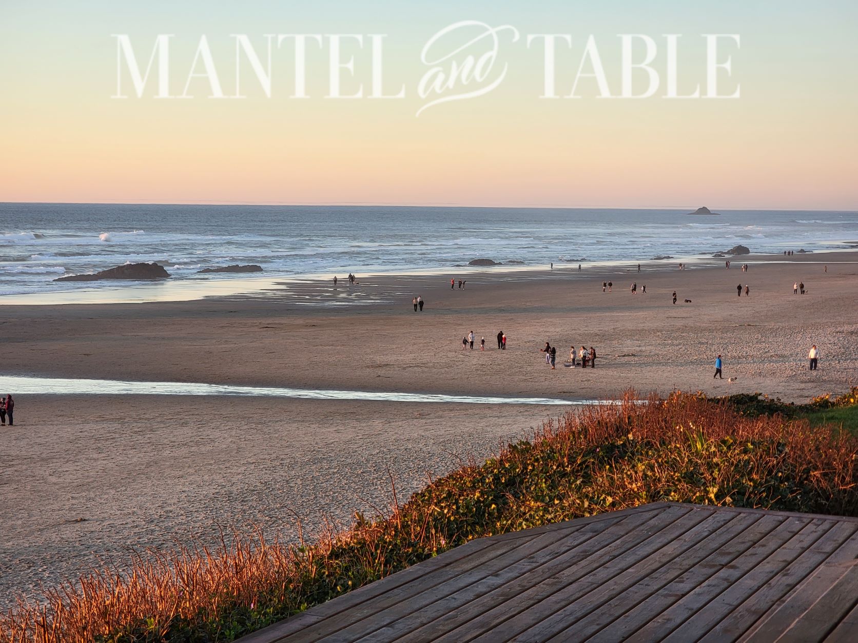 view from deck of people on the beach in the afternoon