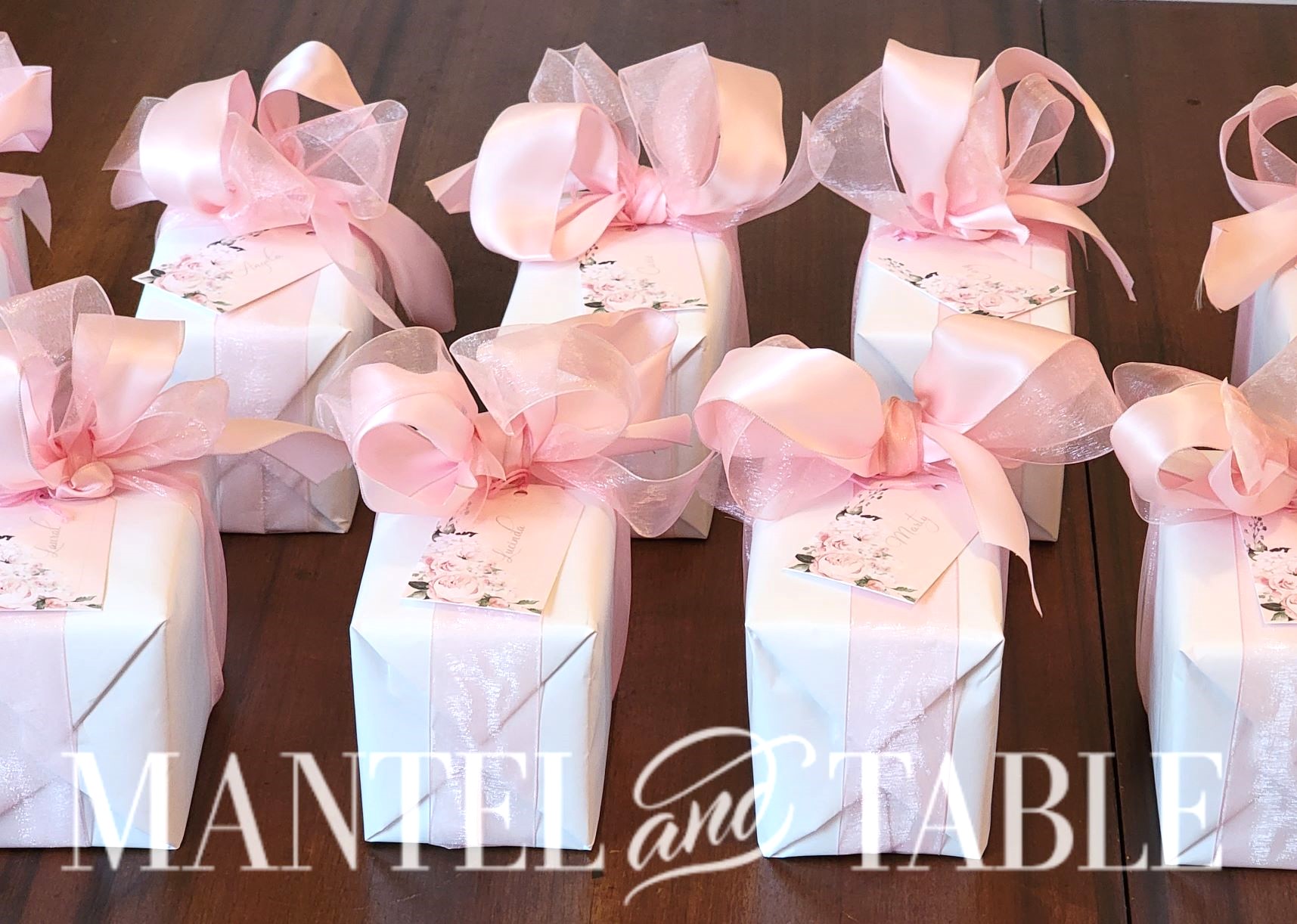 Several boxes wrapped in pink and white