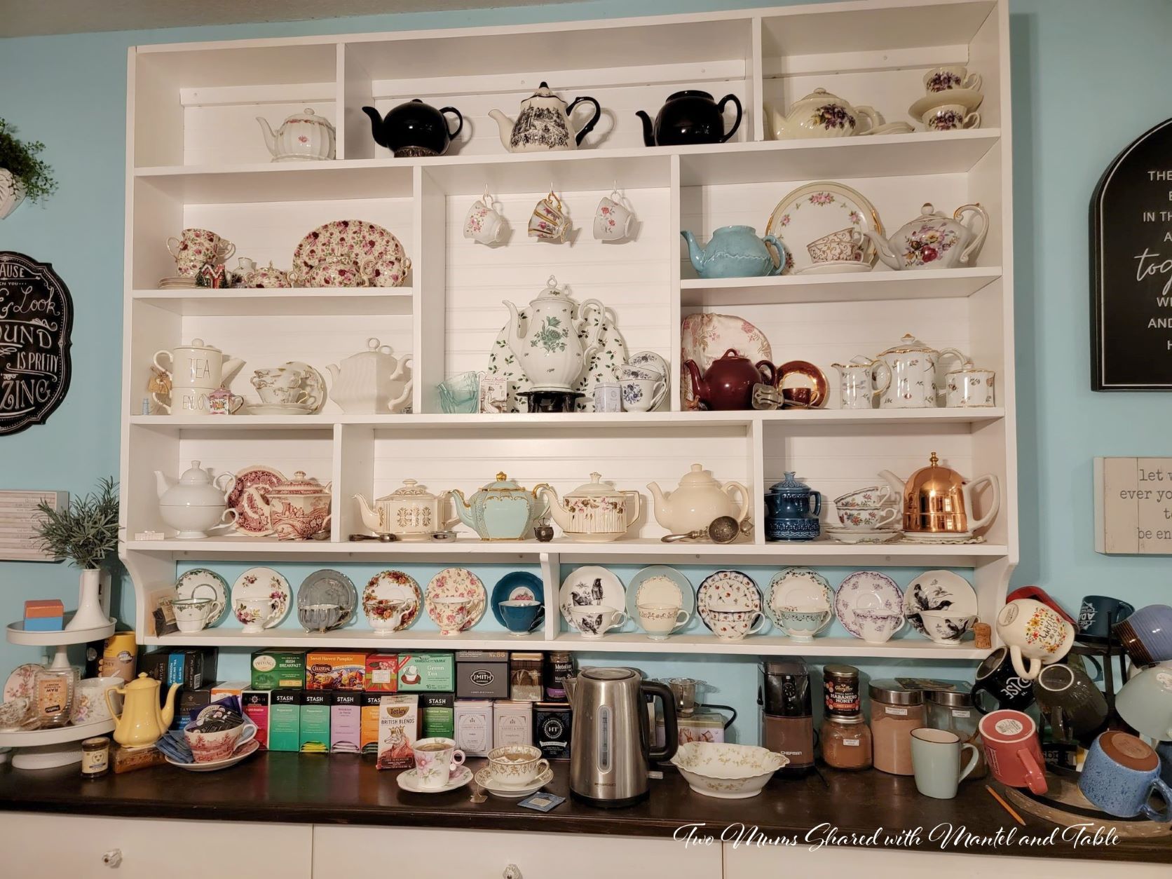 Teacups and teapots on large wall shelf - Tea and scones post