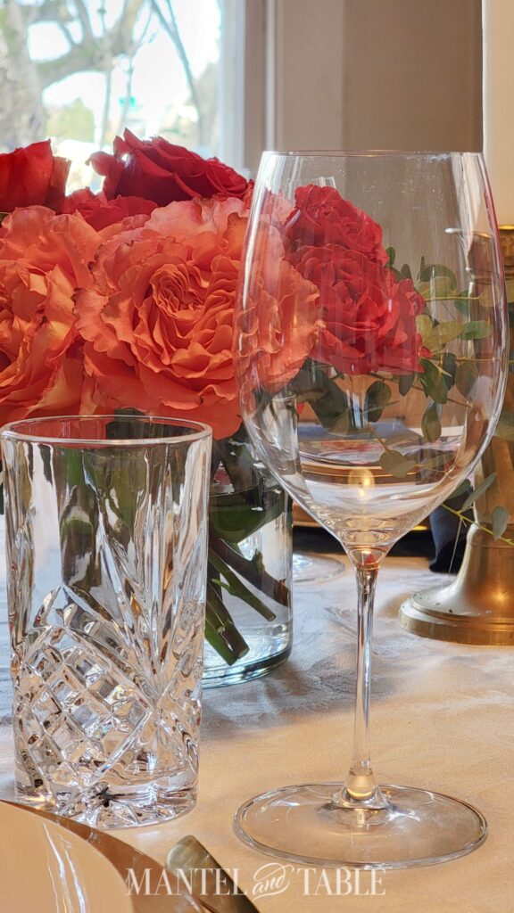Closeup of crystal water glass and wine glass in a place setting