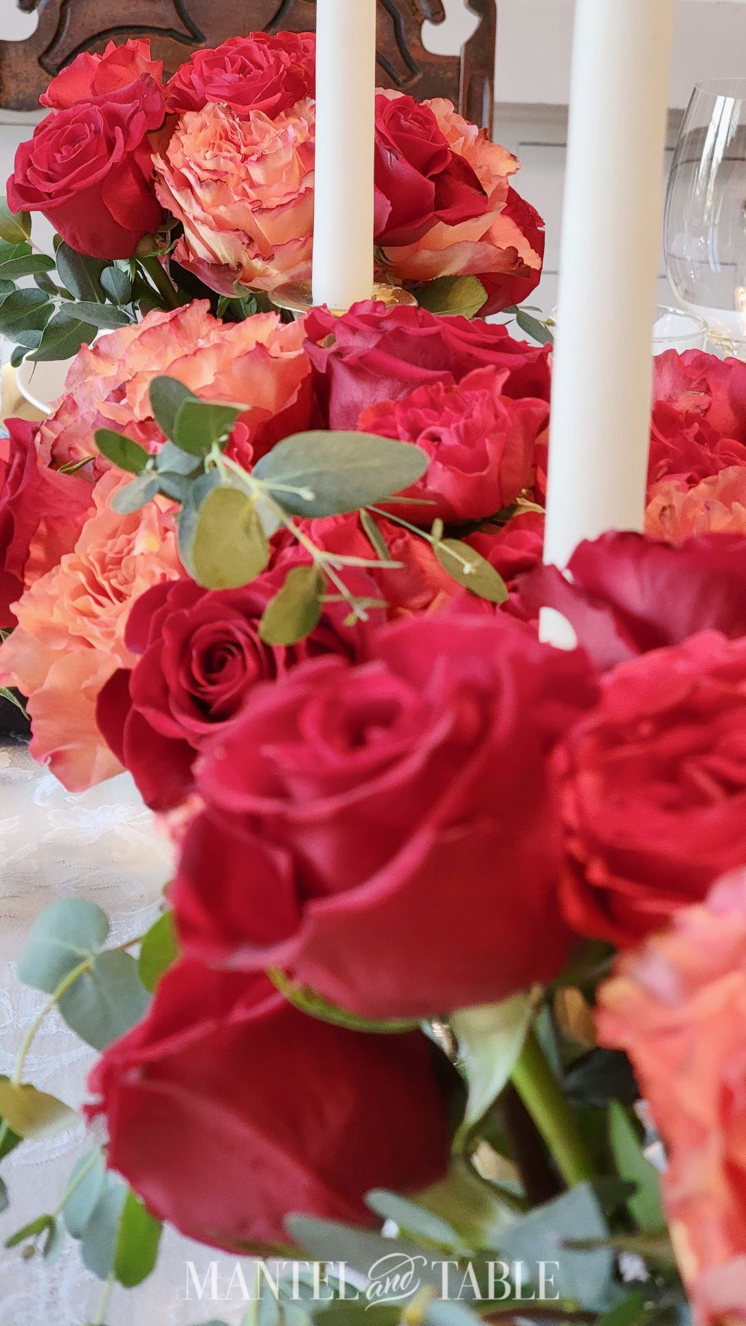 flower arrangement centerpiece of red and peach roses