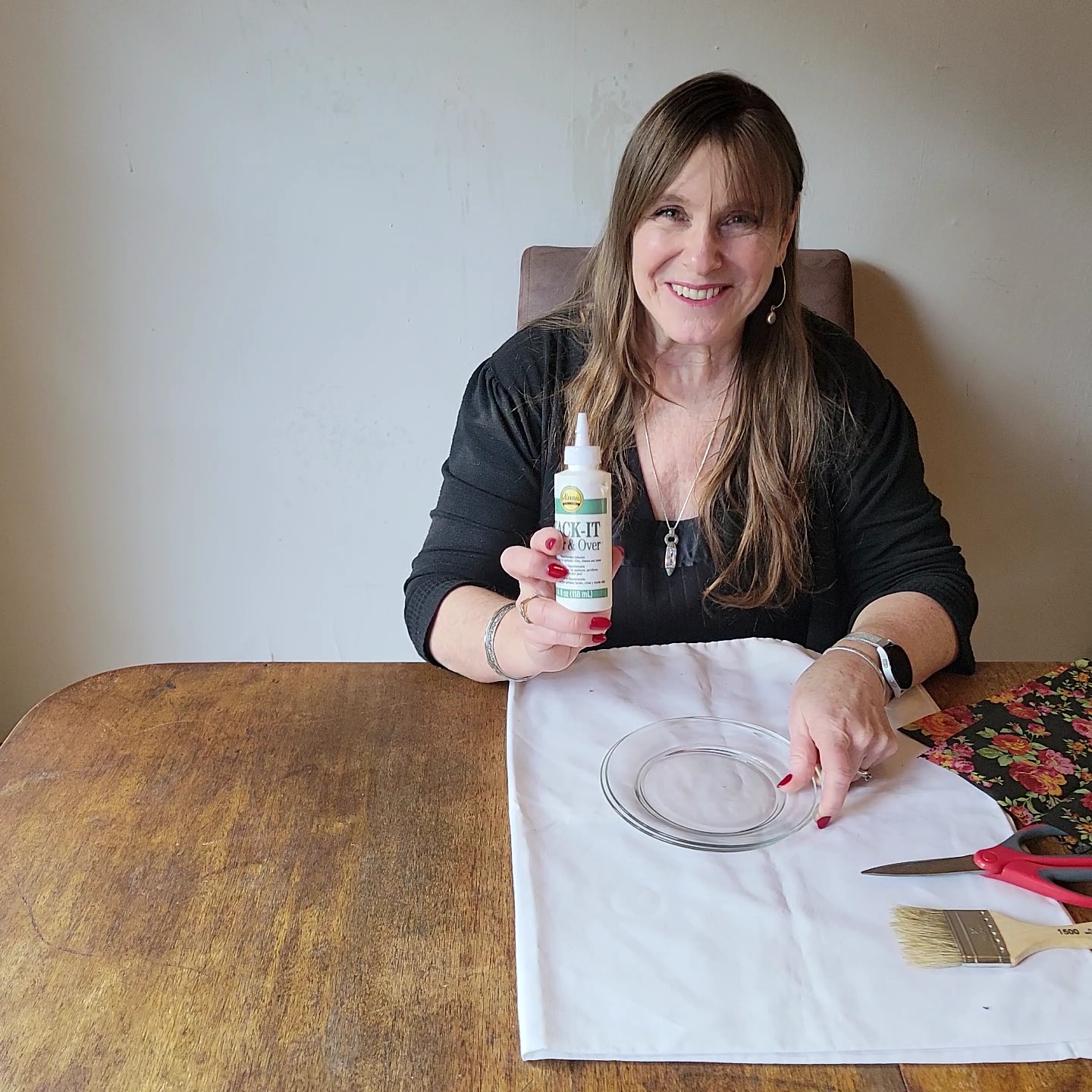 Two table setting problems solved!
Woman holding bottle of glue