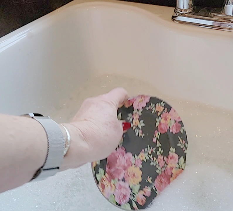 Two table setting problems solved! Putting a plate into soapy water in the sink