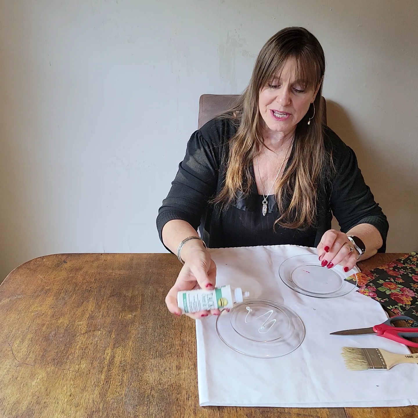 Two table setting problems solved! Woman pouring glue onto a glass plate