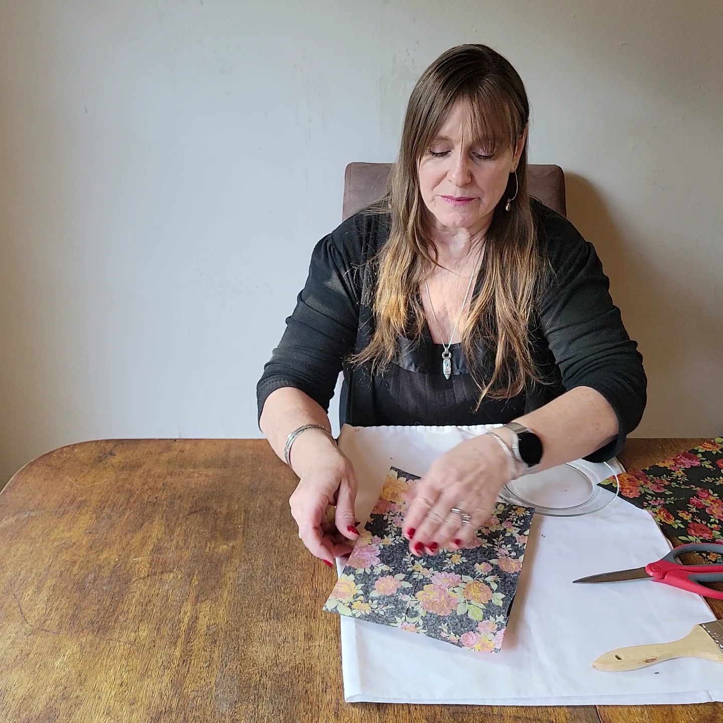 Two table setting problems solved! Woman placing tissue paper over a plate