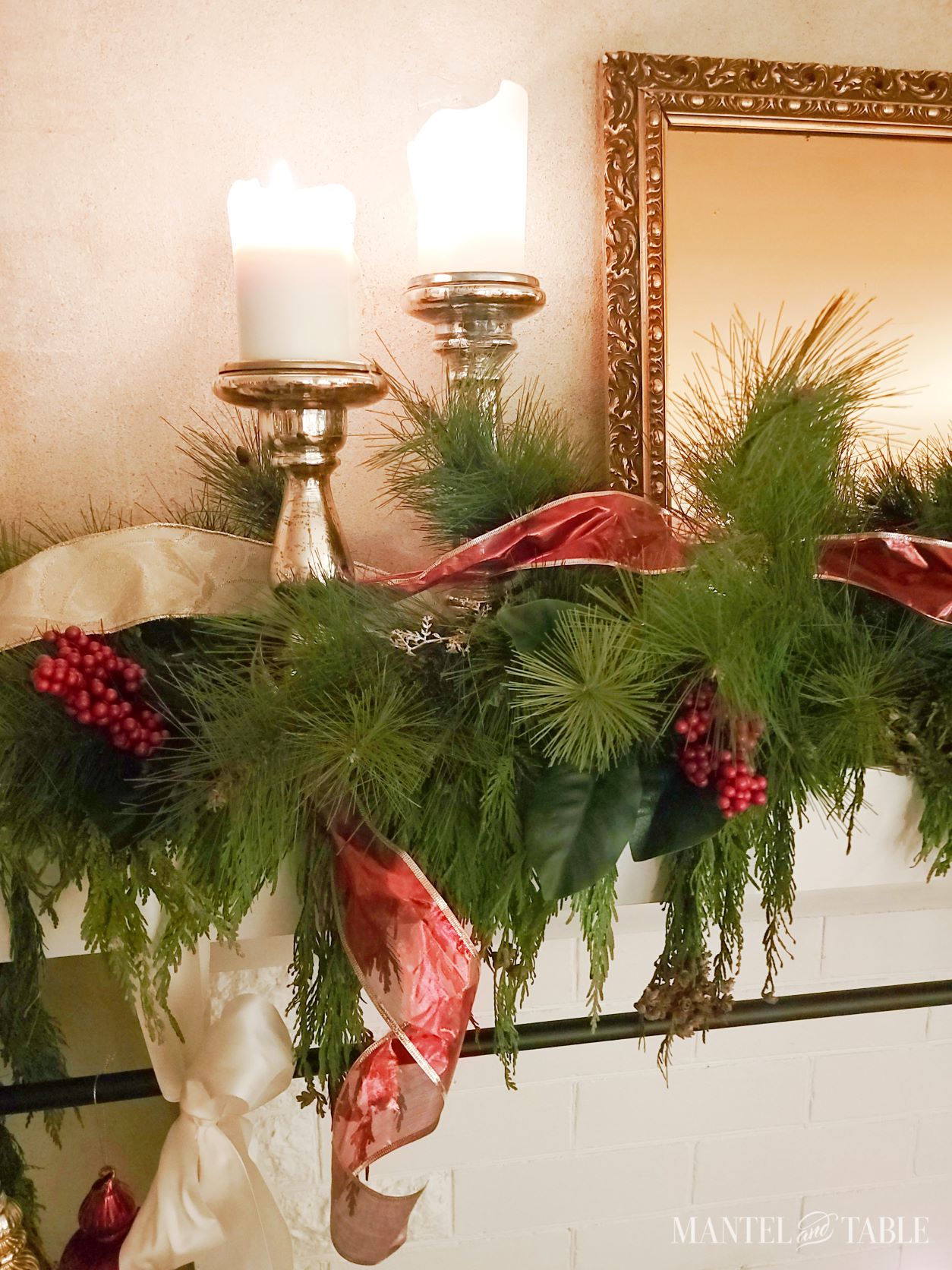 Closeup of candle holders and evergreens