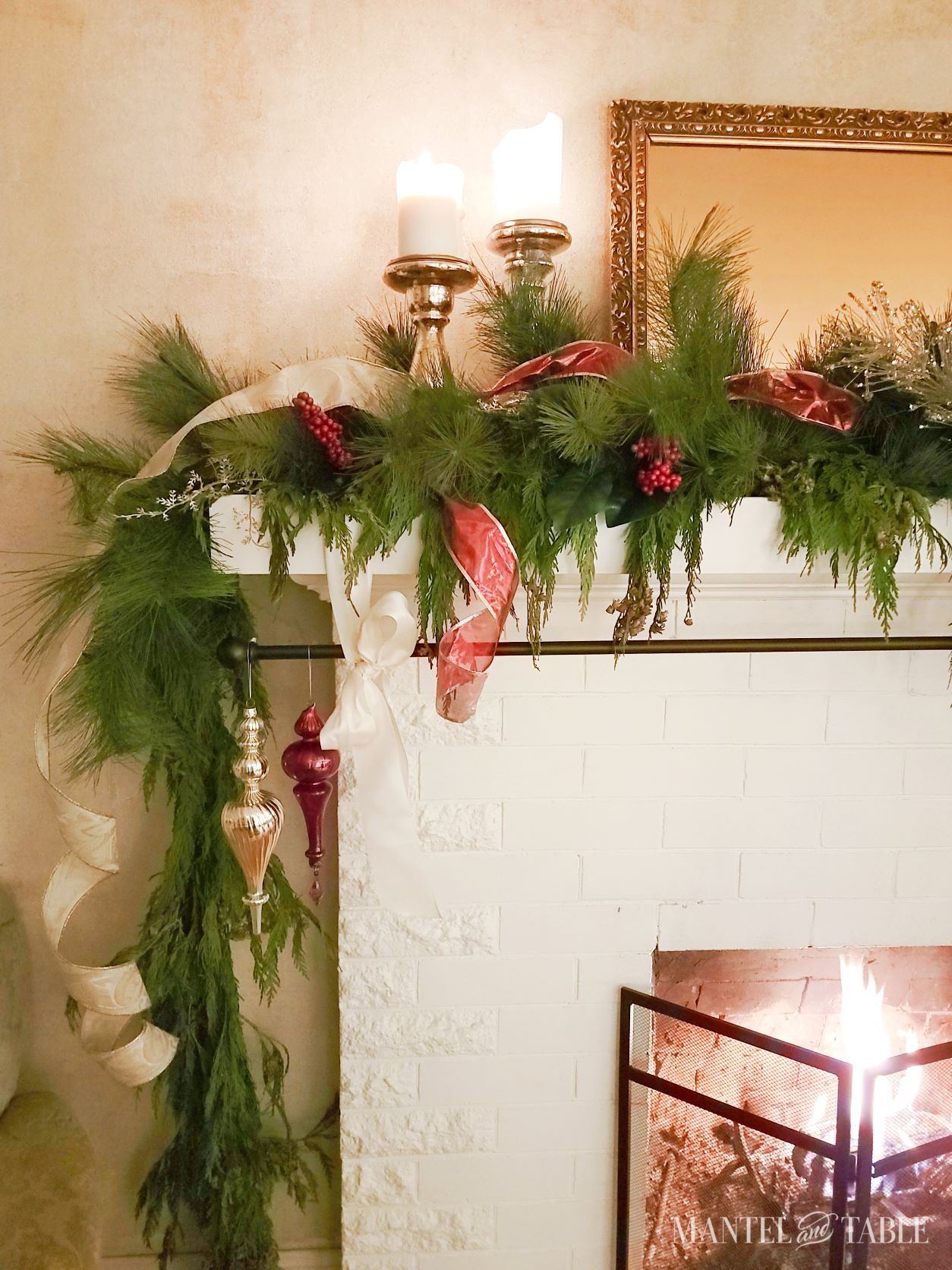 Christmas Mantel with candles and ribbon