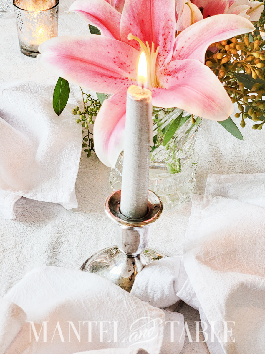 Silver glitter candle and pink lily