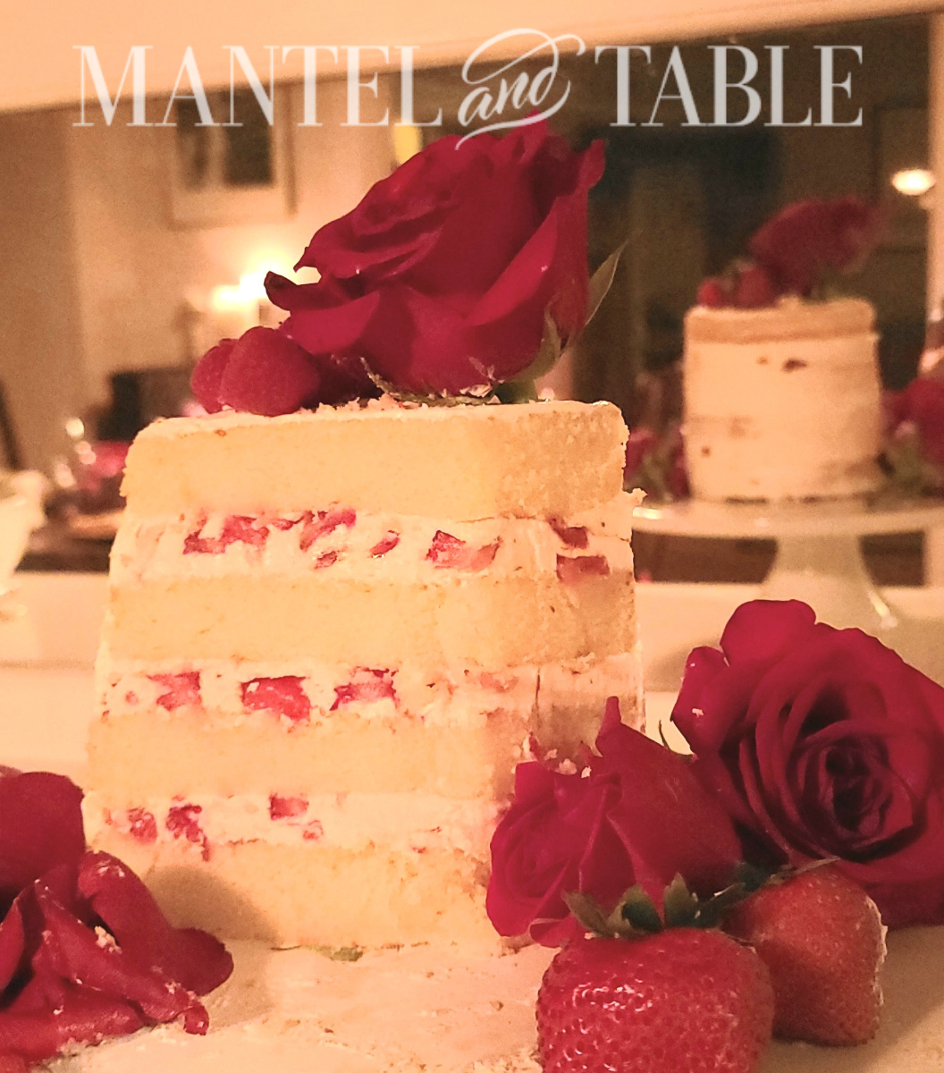 Cut champagne cake with berries in the filling