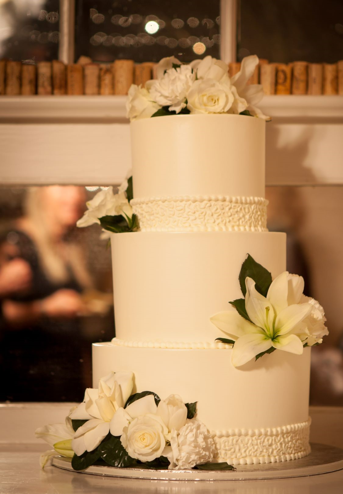 Three-tiered white wedding cake