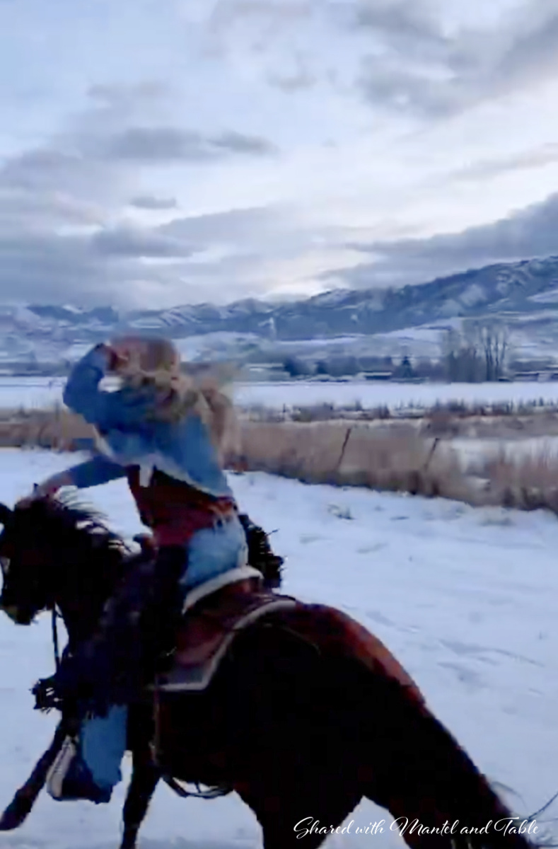 Our teacup host Alexis riding full out on a horse through snow covered fields