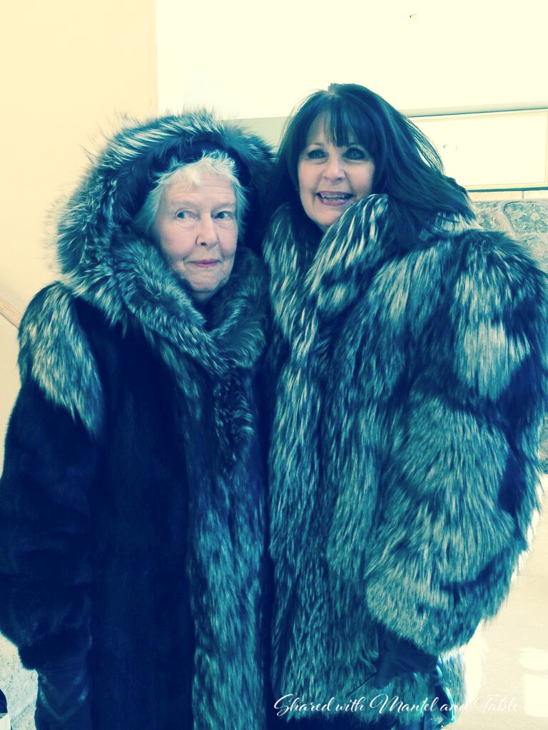 Two women wearing very heavy fur coats