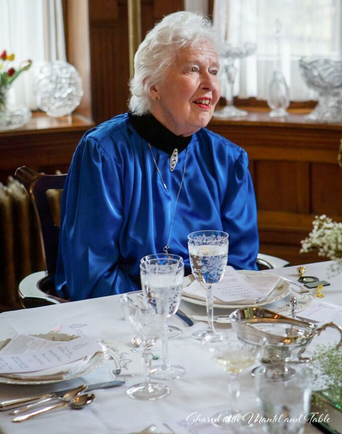 Lovely mature woman at a beautiful formal table.