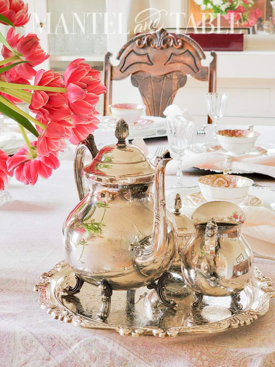 Organize a tea party - silver tea set on the table