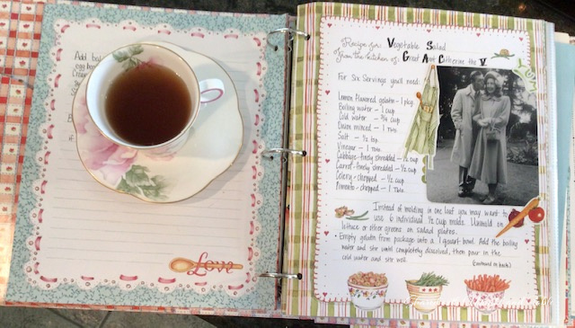 Teacup on the ranch posing with a cookbook of family recipes