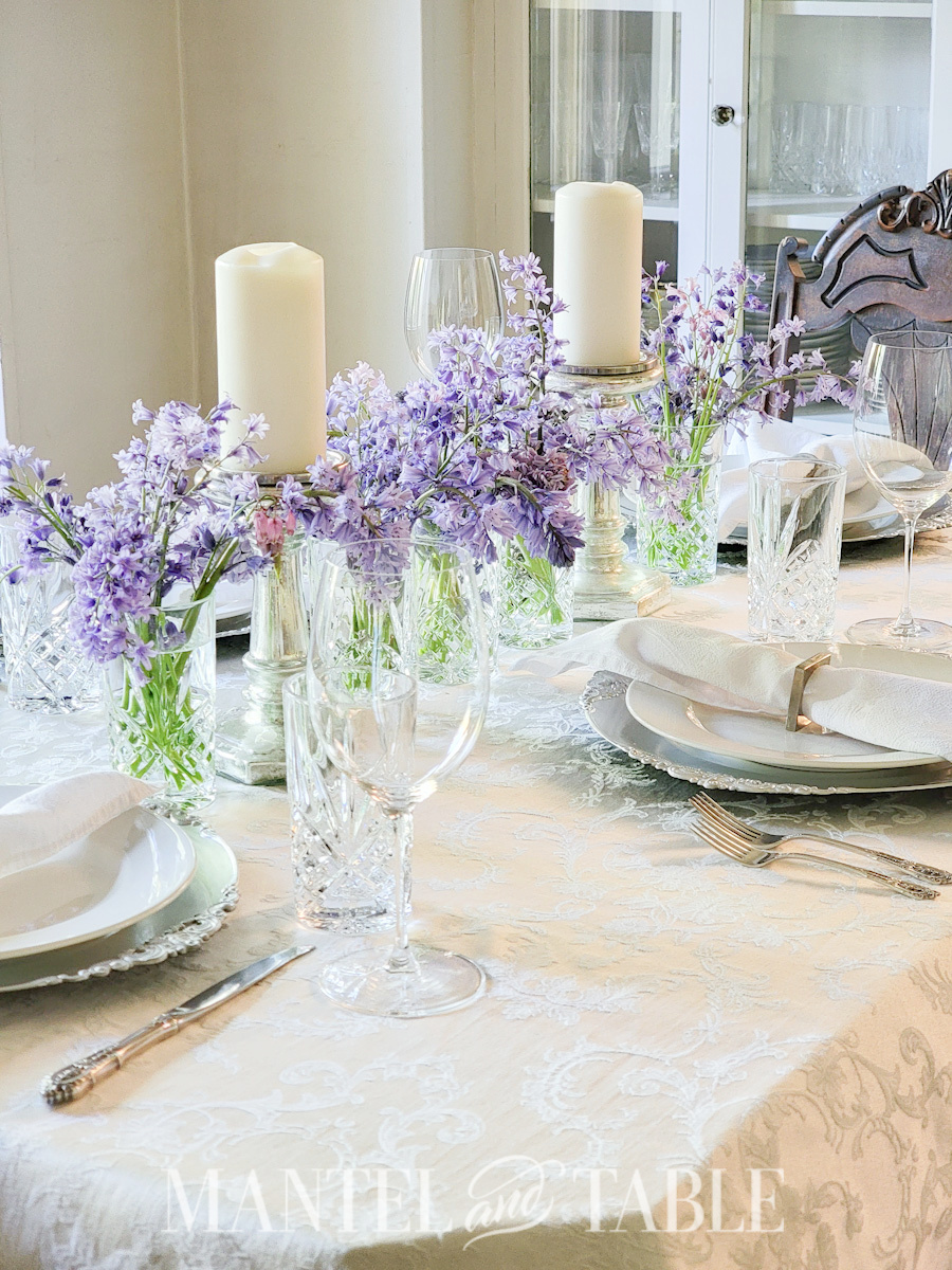Purple flower centerpiece on white table setting